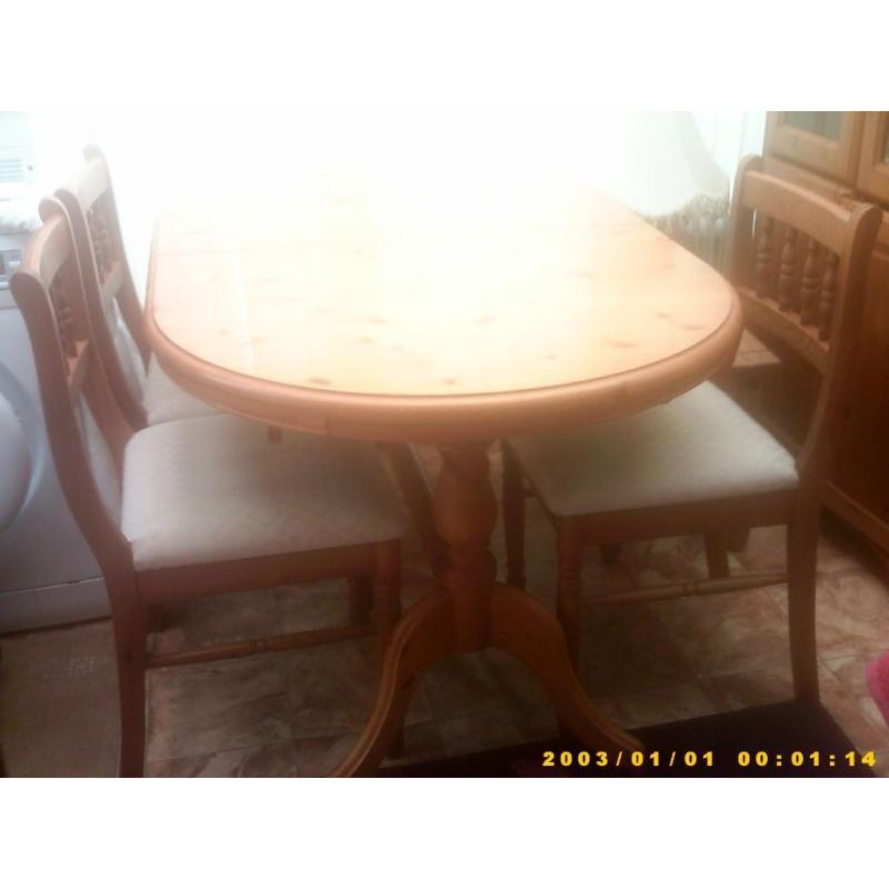 pine table and four chairs