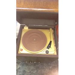 Record player in wooden cabinet