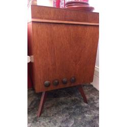 Record player in wooden cabinet