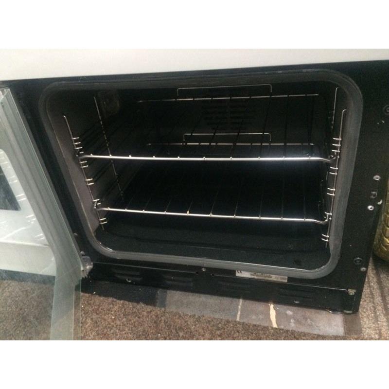 Black & silver new home 60cm ceramic hub electric cooker grill & fan oven good condition with guara