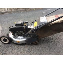 Petrol mower with rear roller