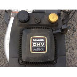 Petrol mower with rear roller