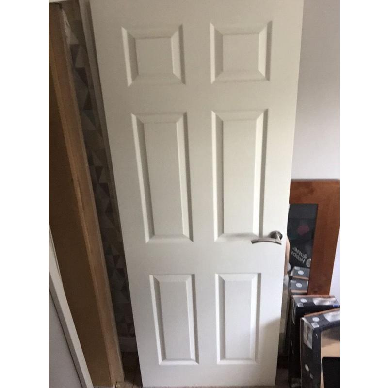Internal wooden door with hinges and handle