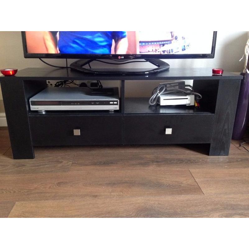 Black TV stand in good condition. 120cm long x 39cm wide x 42 cm high.