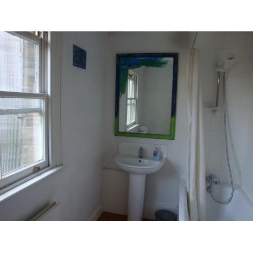 two very large adjoining double bedroom, high ceiling, wooden floor boards with garden view