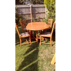 Table and four chairs. Fold down.