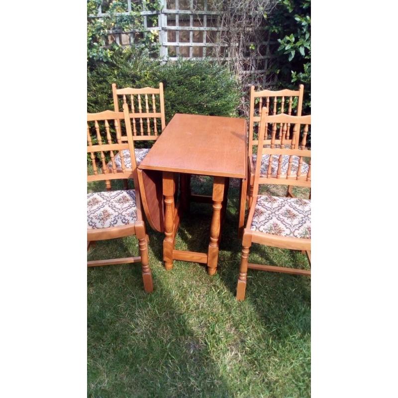 Table and four chairs. Fold down.