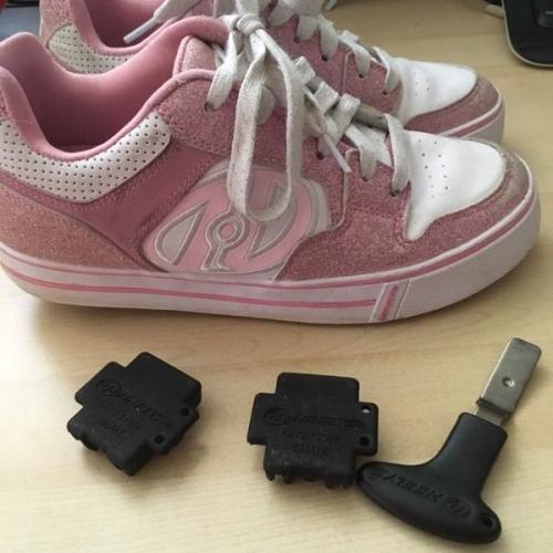 Girls pink heeleys size 4