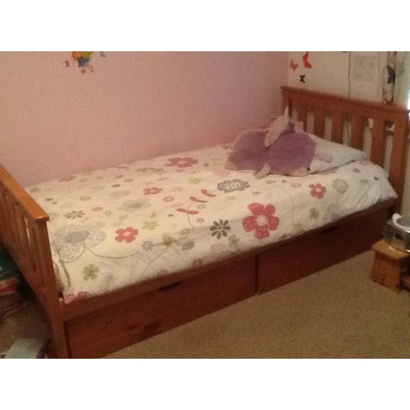 Single wooden bed with storage and mattress included.