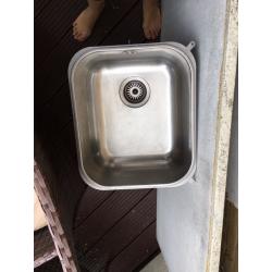 Kitchen sink, tap and waste disposer