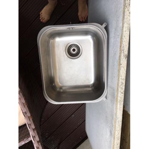 Kitchen sink, tap and waste disposer