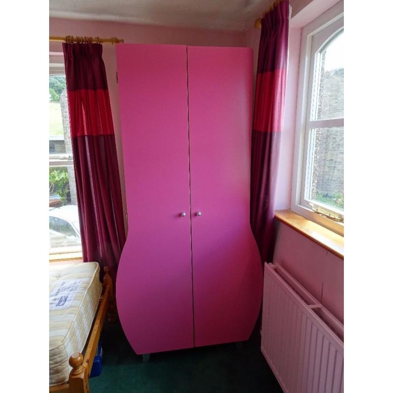 Children's matching pink wardrobe and chest of drawer. Can be bought separately.