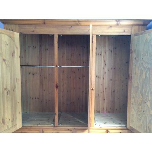 Solid pine 3door Wardrobe with mirror on one. It is 208cm high, 200 cm wide and 56 cm deep