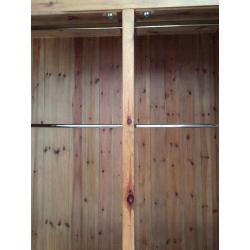 Solid pine 3door Wardrobe with mirror on one. It is 208cm high, 200 cm wide and 56 cm deep