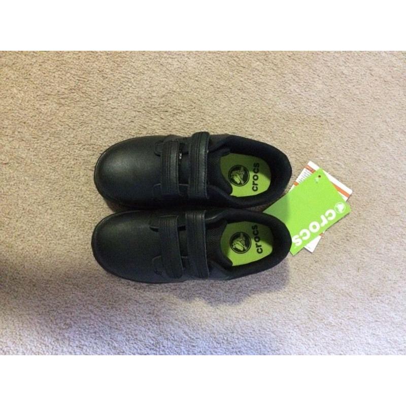 Brand new Crocs. Size 12/13 boys black school shoes.