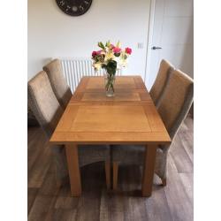 Extending solid oak dining table with 4 chairs