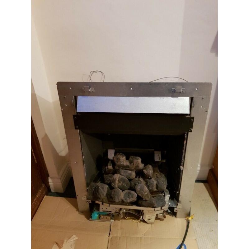 Fire surround with gas log effect fire