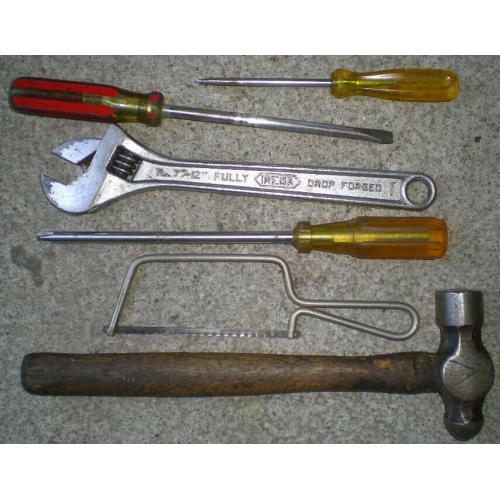 Assortment of hand tools, hammer, screwdrivers (3), saw, 12" adjustable spanner.