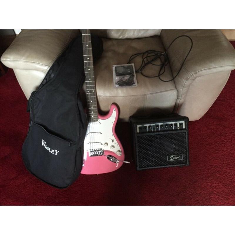 Full size electric guitar, amp, padded case, leads, and guitar tuner