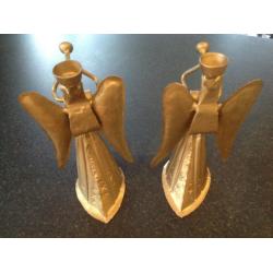 Pair of metal angel candle holders.