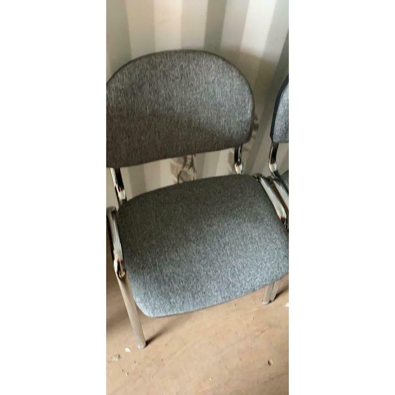 Four grey office chairs stackable vgc ( can deliver)