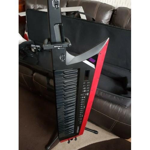 Roland AX synth keytar Edge with case,stand, manual almost new.