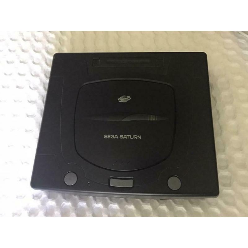 Sega Saturn console with pad and games for sale