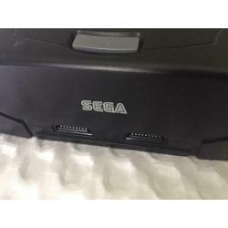 Sega Saturn console with pad and games for sale