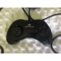 Sega Saturn console with pad and games for sale