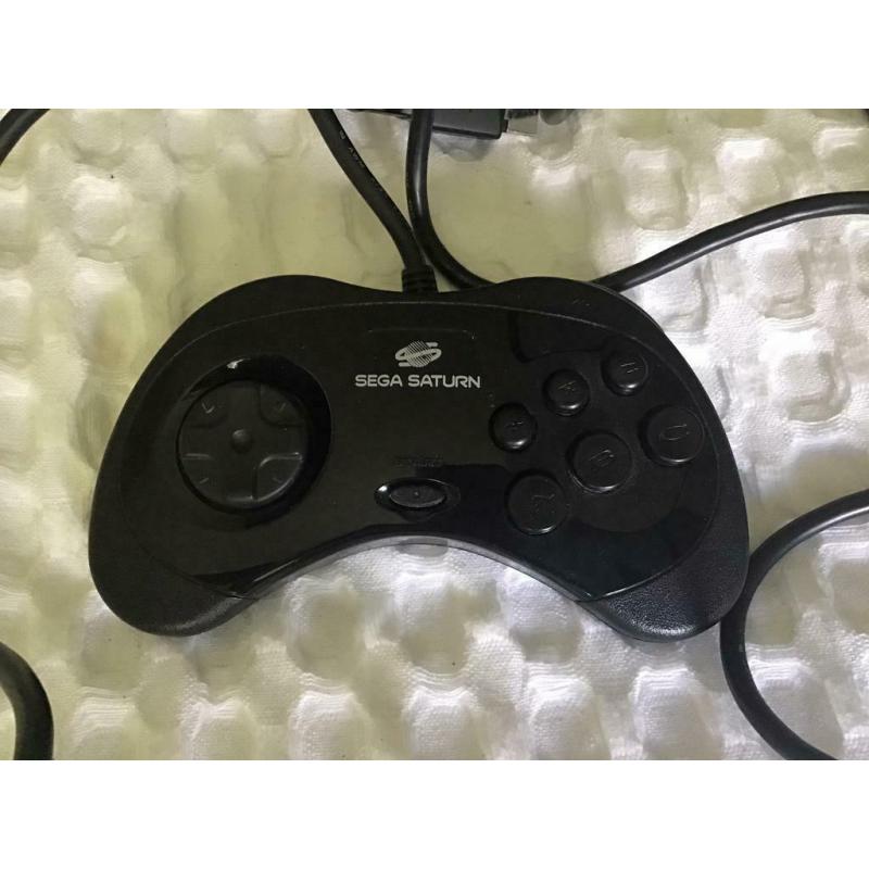 Sega Saturn console with pad and games for sale