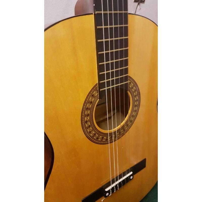 Acoustic Guitar - wooden - hardly used - great condition.
