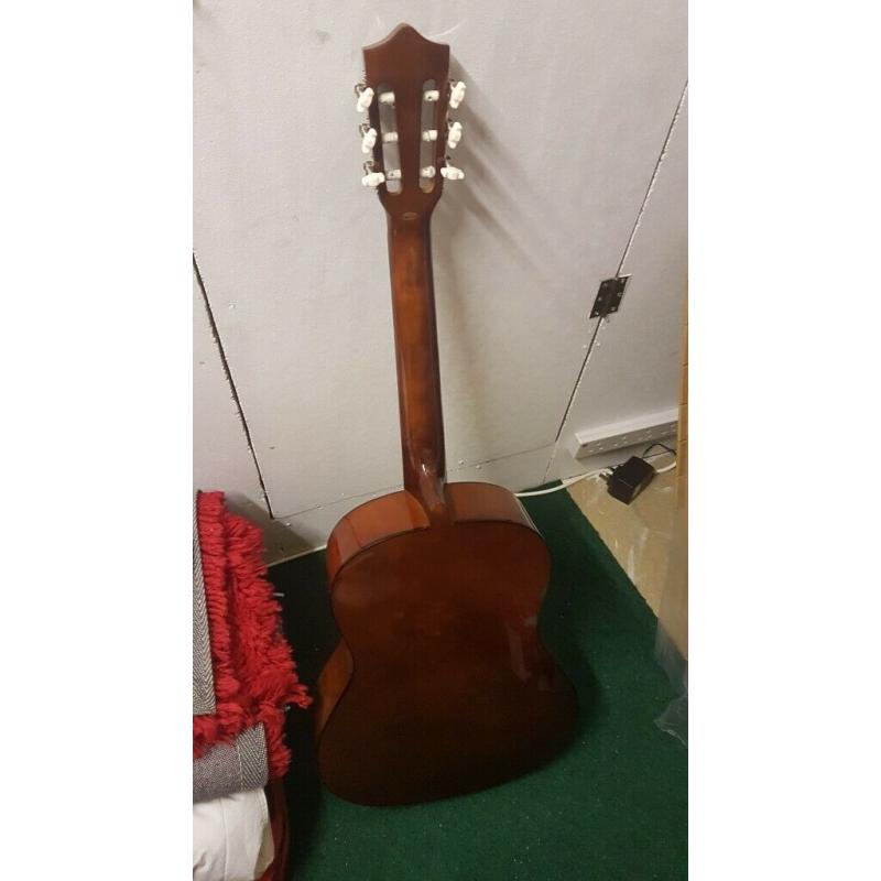 Acoustic Guitar - wooden - hardly used - great condition.